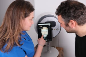 Nurse Kat Cane in Consultation with a male patient using Observe 520x skin scanner