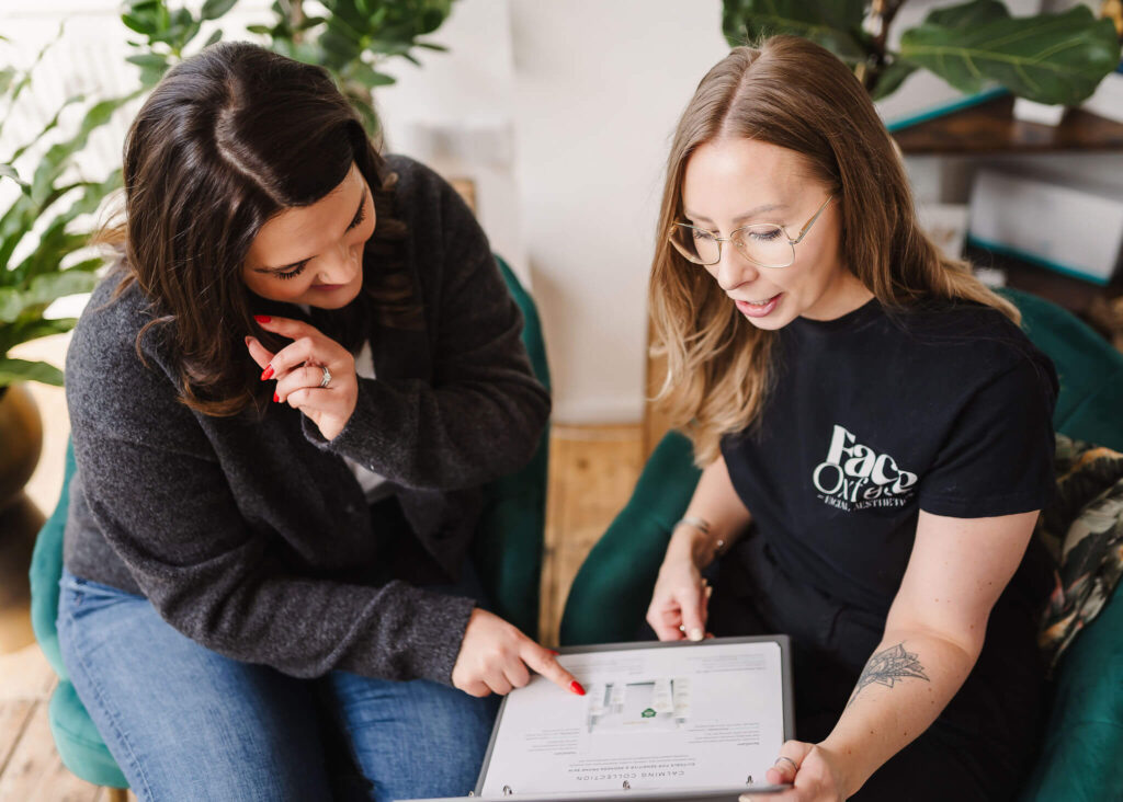 Emily chatting with a client about her Byonik Regenerative Treatment