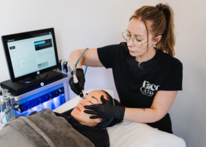 Nurse performing professional micro needling treatment at Face Oxford aesthetics clinic for skin rejuvenation and repair.